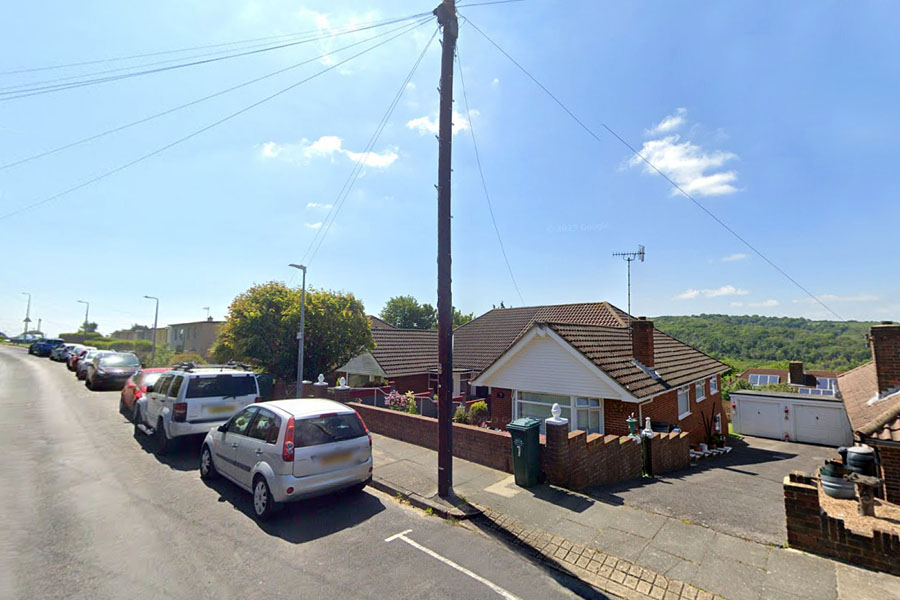 Wheatfield Way with garages visible down slope