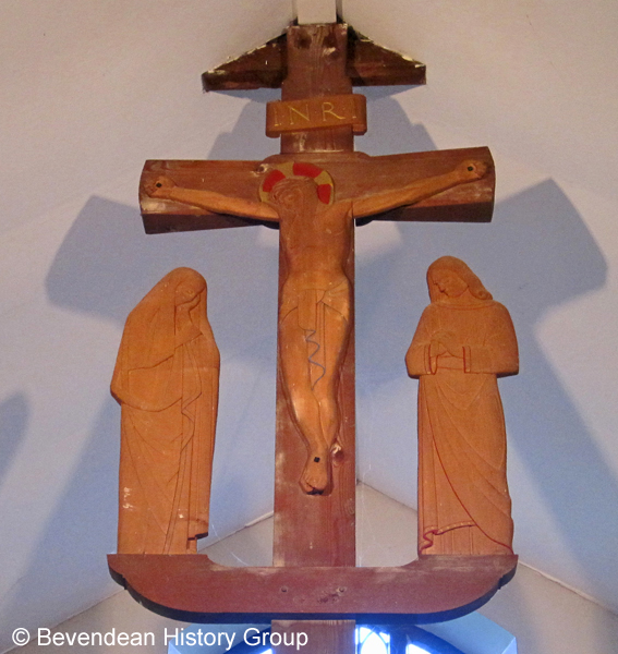 Carving of Christ, St Mary and St John on Church Beam above Sanctuary